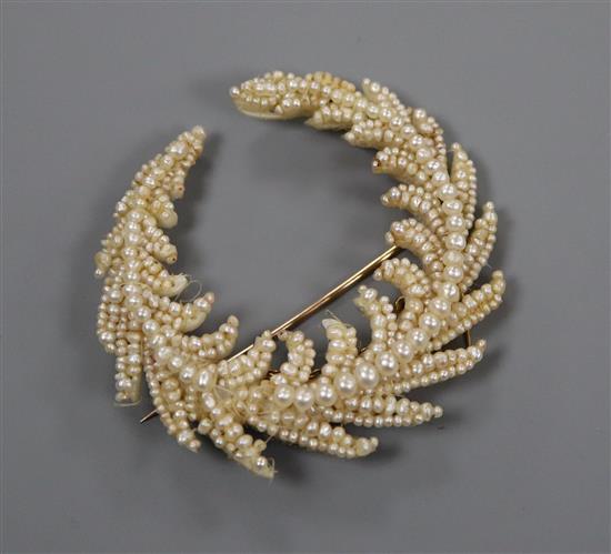 A Regency seed pearl set mother of pearl spray brooch, 55mm.